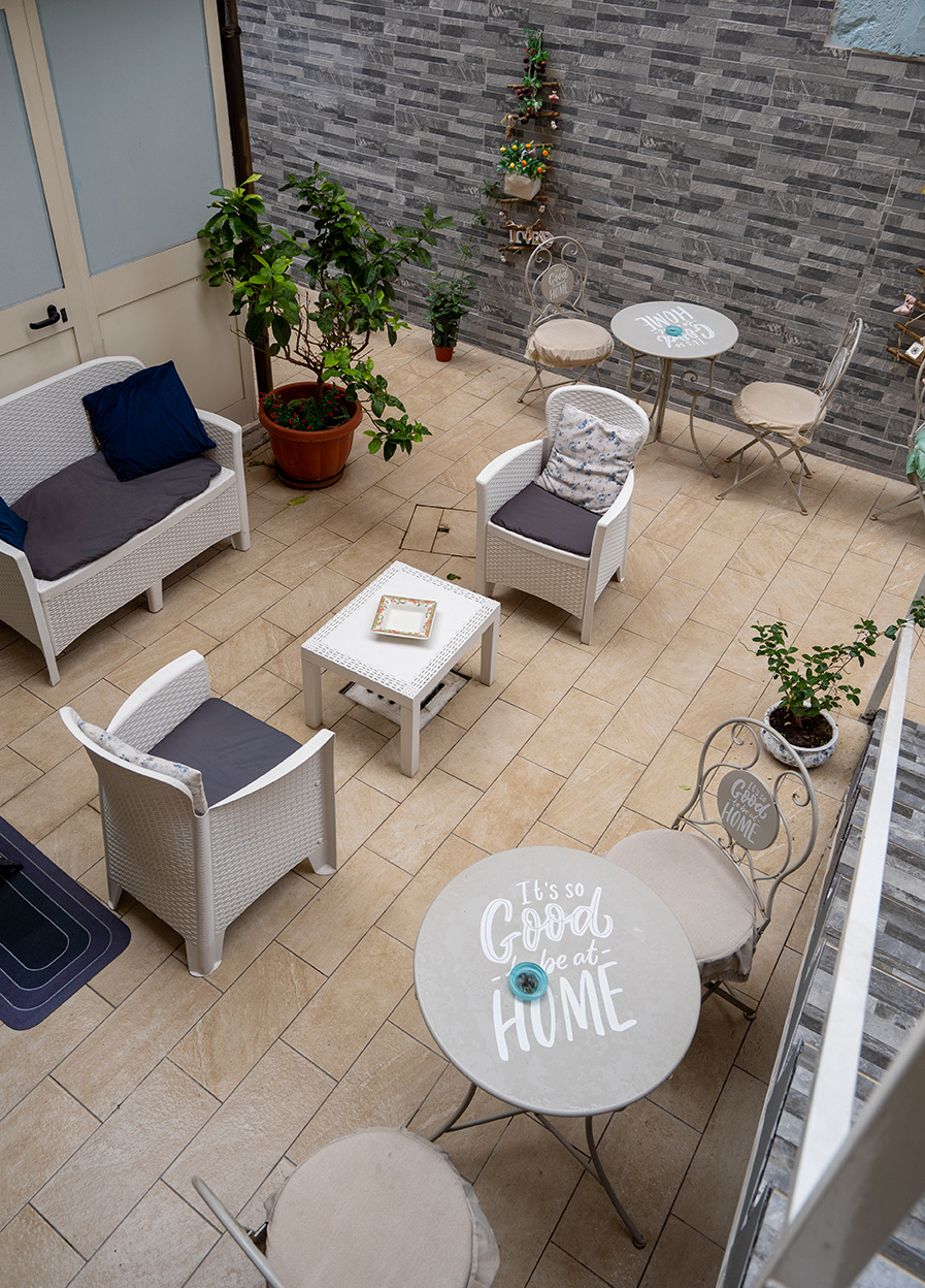 The Gloves Rooms terrace with armchairs, plants and small tables